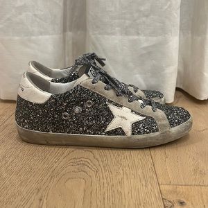 Silver and Black Glitter Golden Goose Brand sneakers.